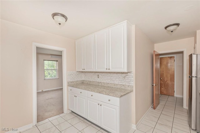 3271 Warrensville Center Rd Unit 4A, Shaker Heights, OH 44122 - kitchen featuring freestanding refrigerator, white cabinets, and light tile patterned floors