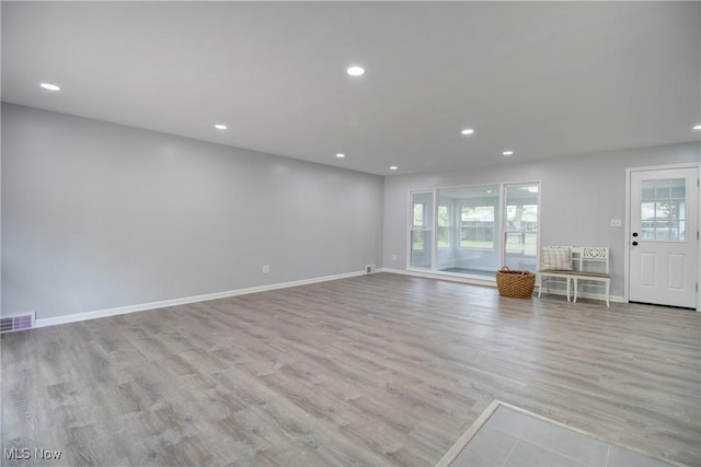 2764 Walter Rd, Westlake, OH 44145 - unfurnished living room featuring plenty of natural light, wood finished floors, and recessed lighting