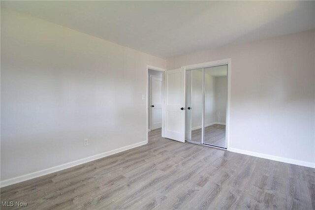 2764 Walter Rd, Westlake, OH 44145 - unfurnished bedroom with wood finished floors and a closet