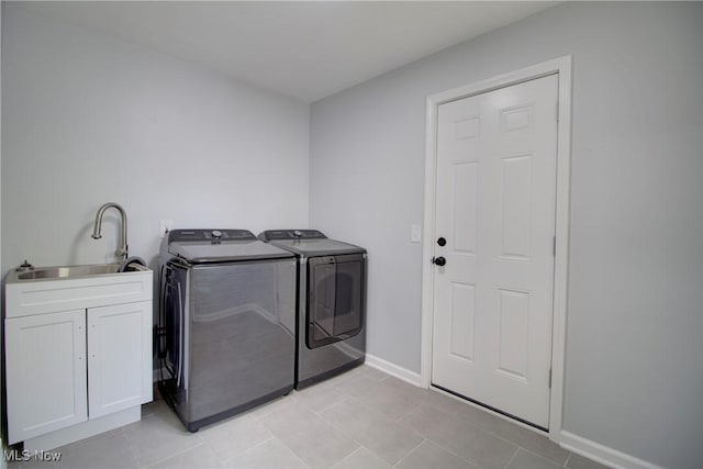 2764 Walter Rd, Westlake, OH 44145 - laundry area with independent washer and dryer, cabinet space, and light tile patterned floors