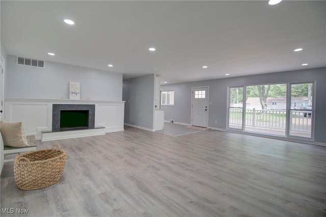 2764 Walter Rd, Westlake, OH 44145 - unfurnished living room with recessed lighting, wood finished floors, and a fireplace with raised hearth