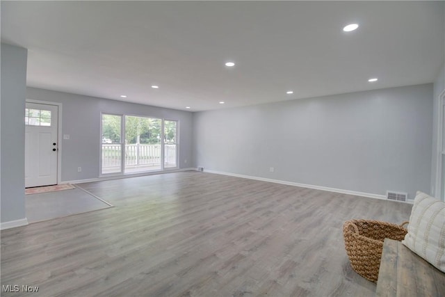 2764 Walter Rd, Westlake, OH 44145 - unfurnished living room with light wood-style floors and recessed lighting