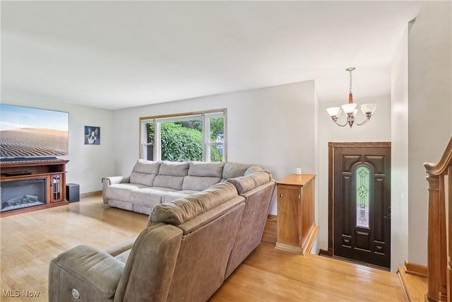 1455 Buckeye Cir, Salem, OH 44460 - living room featuring a chandelier and light wood finished floors