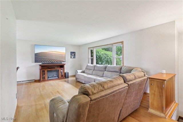 1455 Buckeye Cir, Salem, OH 44460 - living room featuring a baseboard radiator and light wood-style flooring