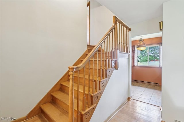 1455 Buckeye Cir, Salem, OH 44460 - stairs featuring baseboard heating and wood finished floors