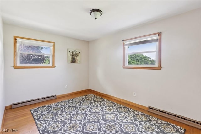 1455 Buckeye Cir, Salem, OH 44460 - empty room with a baseboard radiator and wood finished floors