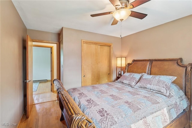 1455 Buckeye Cir, Salem, OH 44460 - bedroom with wood finished floors, a closet, and a ceiling fan