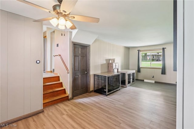 1455 Buckeye Cir, Salem, OH 44460 - living room featuring light wood-style flooring, a ceiling fan, and stairs
