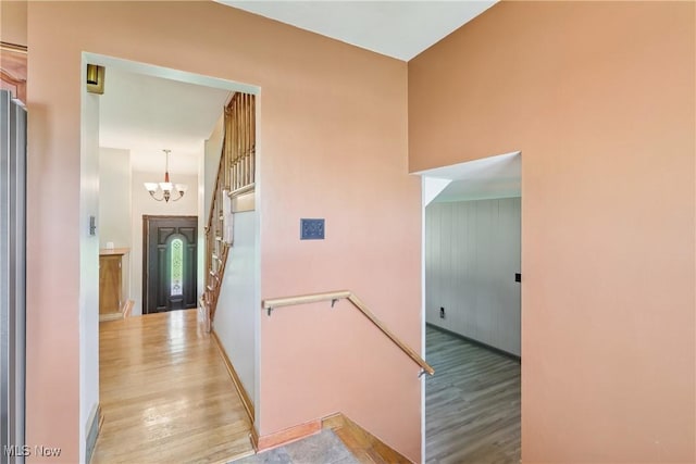 1455 Buckeye Cir, Salem, OH 44460 - corridor with a chandelier and light wood-style floors