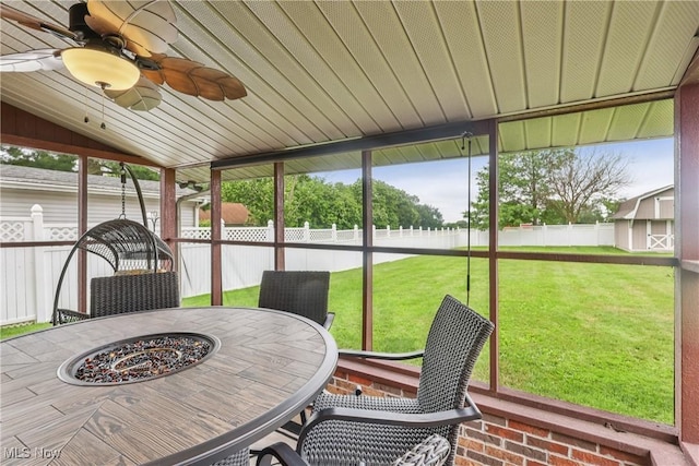 1455 Buckeye Cir, Salem, OH 44460 - sunroom with lofted ceiling, a ceiling fan, outdoor dining space, and an outdoor fire pit