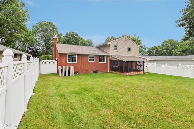 1455 Buckeye Cir, Salem, OH 44460 - back of property featuring a sunroom, a fenced backyard, brick siding, and a chimney