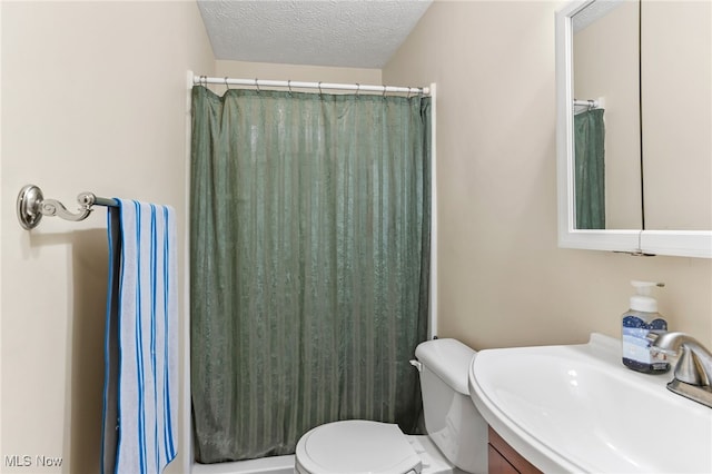 845 Dunny Ave, Sheffield Lake, OH 44054 - bathroom with vanity, a shower with shower curtain, and a textured ceiling