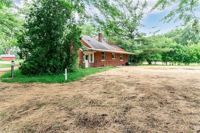 9509 Reed Rd, Columbia Station, OH 44028 - view of front of property featuring brick siding and a chimney