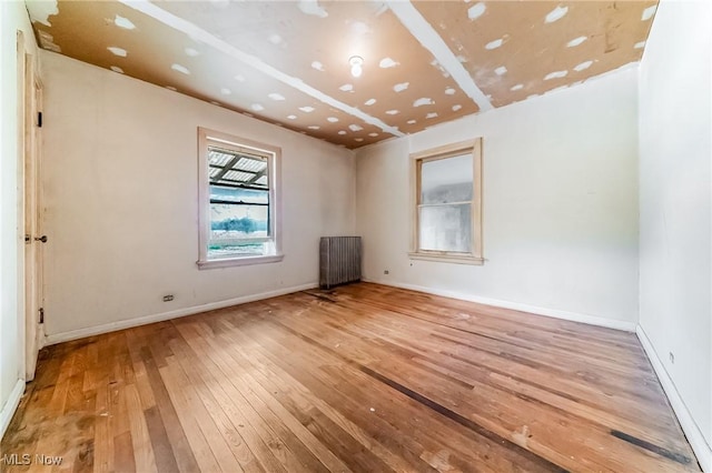 9509 Reed Rd, Columbia Station, OH 44028 - unfurnished room featuring hardwood / wood-style floors and radiator