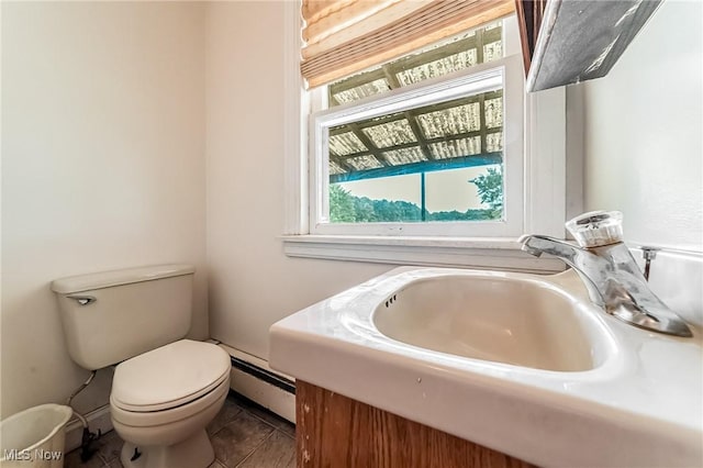 9509 Reed Rd, Columbia Station, OH 44028 - bathroom with a baseboard radiator, tile patterned floors, and vanity