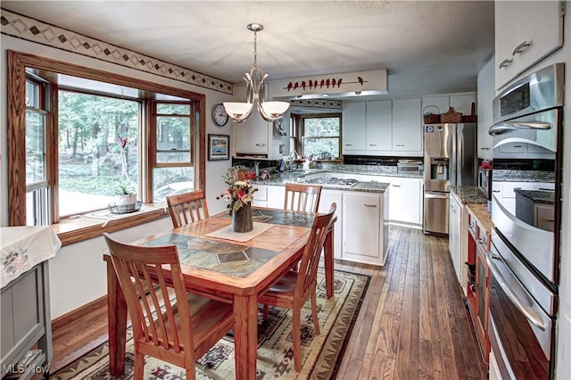 3366 Darrow Rd, Stow, OH 44224 - dining area featuring dark wood finished floors