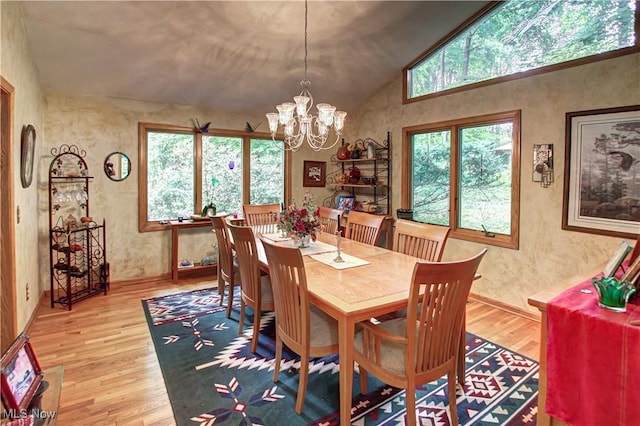 3366 Darrow Rd, Stow, OH 44224 - dining space with wood finished floors, a chandelier, and high vaulted ceiling