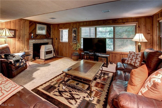 3366 Darrow Rd, Stow, OH 44224 - living room featuring wood walls and a tile fireplace