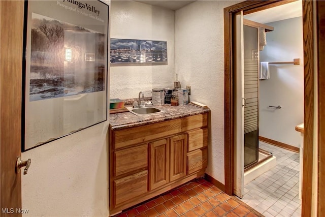 3366 Darrow Rd, Stow, OH 44224 - bathroom with vanity, tile patterned flooring, a textured wall, and a shower stall