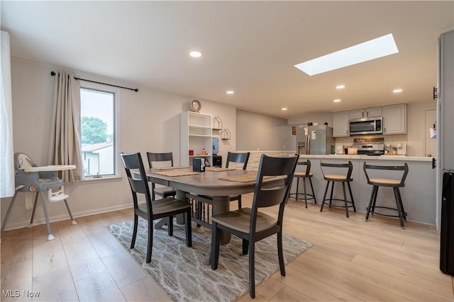 7080 Wren Ave NW, North Canton, OH 44720 - dining space with a skylight, light wood-style floors, and recessed lighting