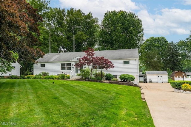 7080 Wren Ave NW, North Canton, OH 44720 - view of front of home featuring driveway, an outbuilding, and a front yard