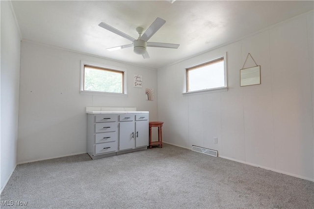 7080 Wren Ave NW, North Canton, OH 44720 - empty room featuring plenty of natural light, light colored carpet, and a ceiling fan