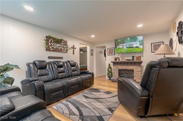 7080 Wren Ave NW, North Canton, OH 44720 - living room featuring light wood-style flooring, recessed lighting, and a fireplace