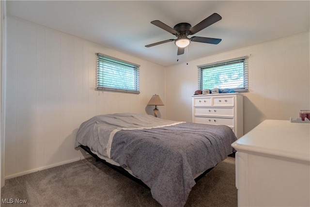7080 Wren Ave NW, North Canton, OH 44720 - bedroom with multiple windows, carpet floors, and ceiling fan