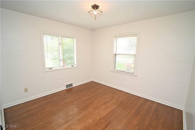 7673 N Lima Rd, Poland, OH 44514 - unfurnished room featuring wood finished floors and baseboards