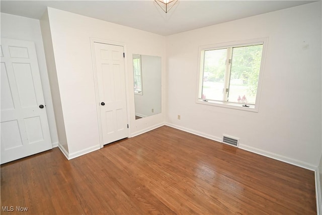 7673 N Lima Rd, Poland, OH 44514 - unfurnished room with wood finished floors and baseboards