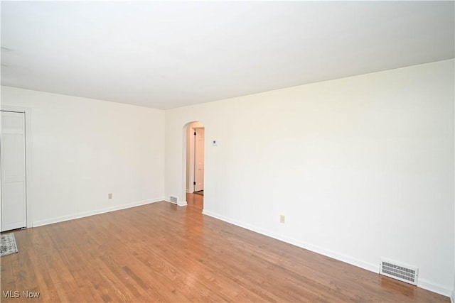 7673 N Lima Rd, Poland, OH 44514 - unfurnished room with arched walkways and wood finished floors