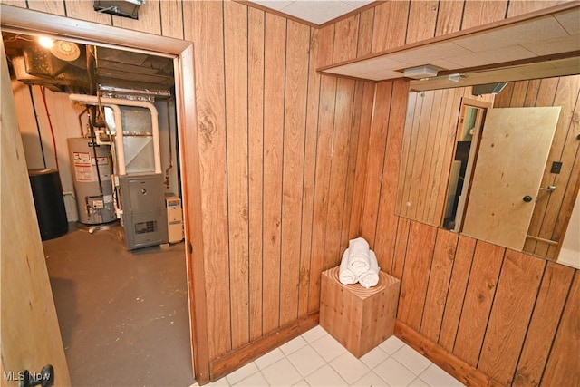 7673 N Lima Rd, Poland, OH 44514 - finished below grade area featuring water heater, wood walls, and heating unit