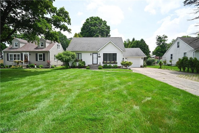 7673 N Lima Rd, Poland, OH 44514 - view of front of house with a garage and a front lawn