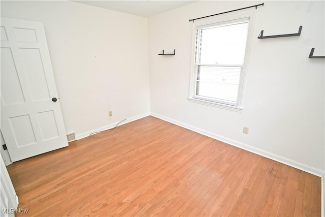 7673 N Lima Rd, Poland, OH 44514 - unfurnished room featuring light wood-type flooring and baseboards