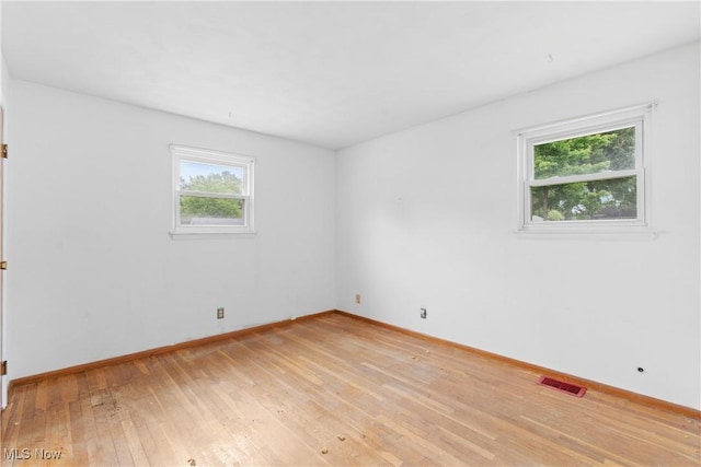 285 Berwin Pl, Munroe Falls, OH 44262 - unfurnished room with healthy amount of natural light and light wood-style floors