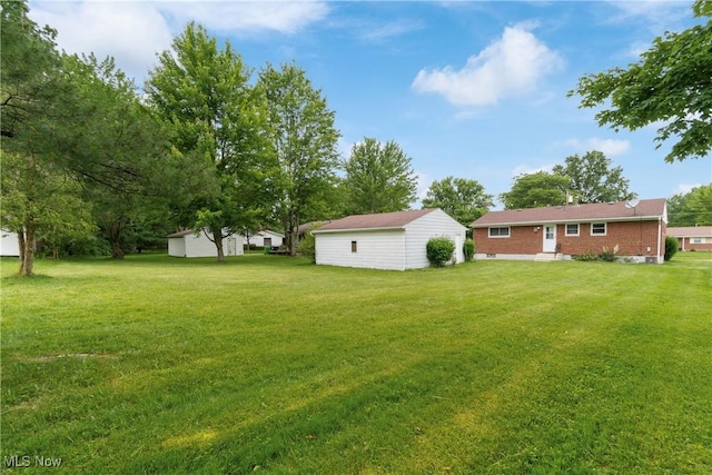 285 Berwin Pl, Munroe Falls, OH 44262 - view of grassy yard featuring an outdoor structure