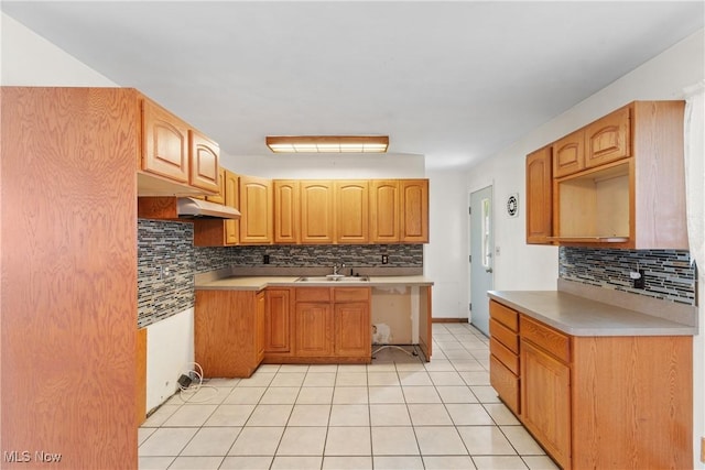 285 Berwin Pl, Munroe Falls, OH 44262 - kitchen with decorative backsplash, light tile patterned floors, under cabinet range hood, and light countertops