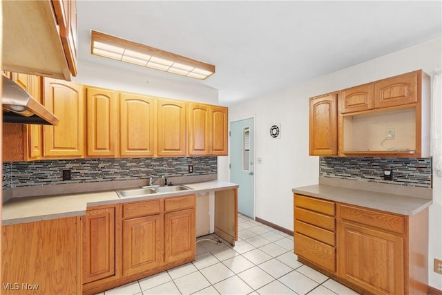 285 Berwin Pl, Munroe Falls, OH 44262 - kitchen featuring under cabinet range hood, backsplash, light tile patterned floors, and light countertops