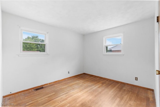 285 Berwin Pl, Munroe Falls, OH 44262 - spare room with healthy amount of natural light and light wood-style floors