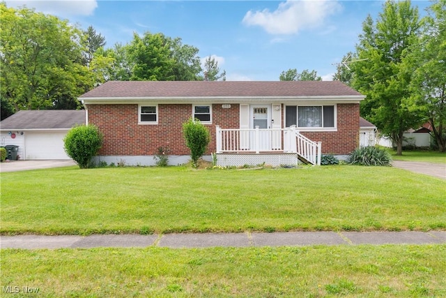 285 Berwin Pl, Munroe Falls, OH 44262 - single story home featuring brick siding, a front yard, and a garage