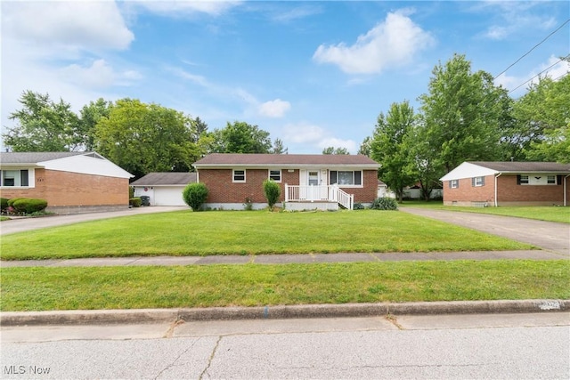 285 Berwin Pl, Munroe Falls, OH 44262 - ranch-style house featuring driveway, a front lawn, and brick siding