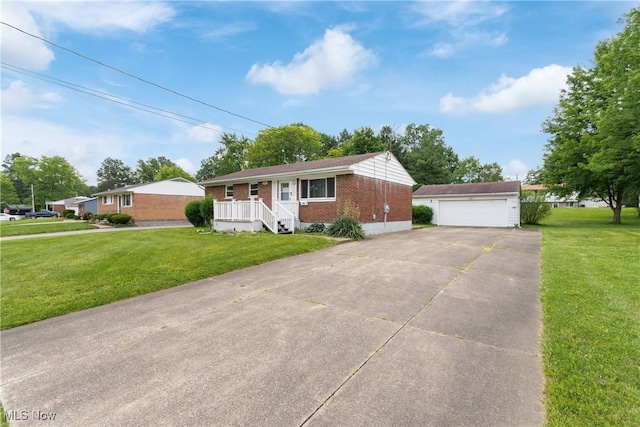 285 Berwin Pl, Munroe Falls, OH 44262 - single story home featuring brick siding, an outdoor structure, a front yard, and a detached garage