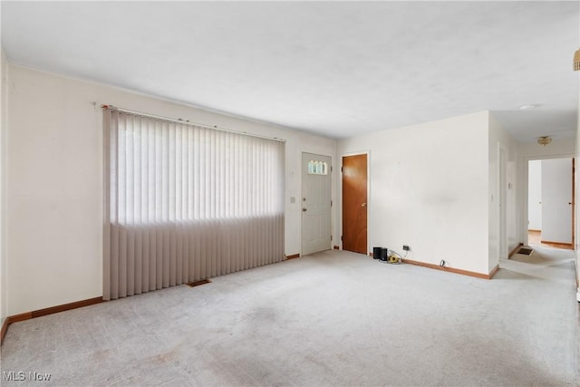 285 Berwin Pl, Munroe Falls, OH 44262 - unfurnished living room featuring carpet floors and baseboards