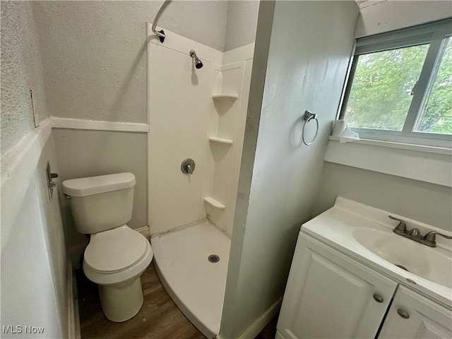 3180 W 90th St, Cleveland, OH 44102 - bathroom with wood finished floors, vanity, and a shower