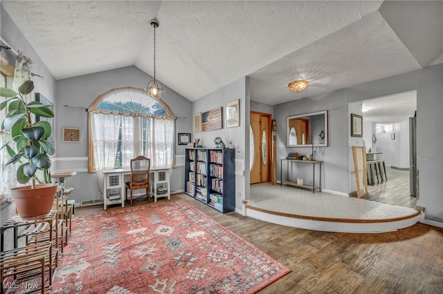 5065 Broadway, Lorain, OH 44052 - interior space with wood finished floors, a textured ceiling, and lofted ceiling