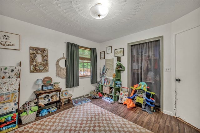 5065 Broadway, Lorain, OH 44052 - rec room featuring wood finished floors and baseboards
