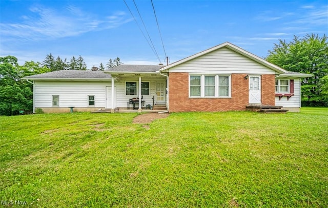 1518 State Route 46 N, Jefferson, OH 44047 - back of property with a lawn and brick siding