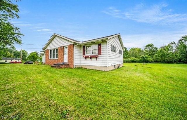 1518 State Route 46 N, Jefferson, OH 44047 - view of front of house featuring a front yard and brick siding