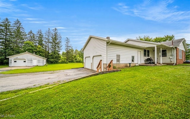 1518 State Route 46 N, Jefferson, OH 44047 - back of property with a lawn and a detached garage