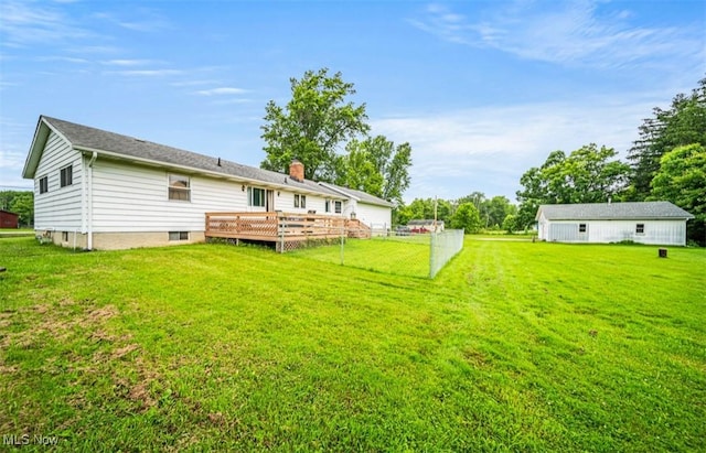 1518 State Route 46 N, Jefferson, OH 44047 - back of property with a wooden deck and a chimney